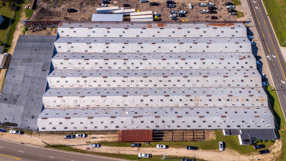 Aerial view of a large industrial warehouse with metal roofing in Wilson, North Carolina.